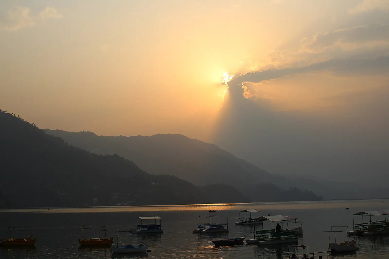 Boats on Phewa Lake at sunset