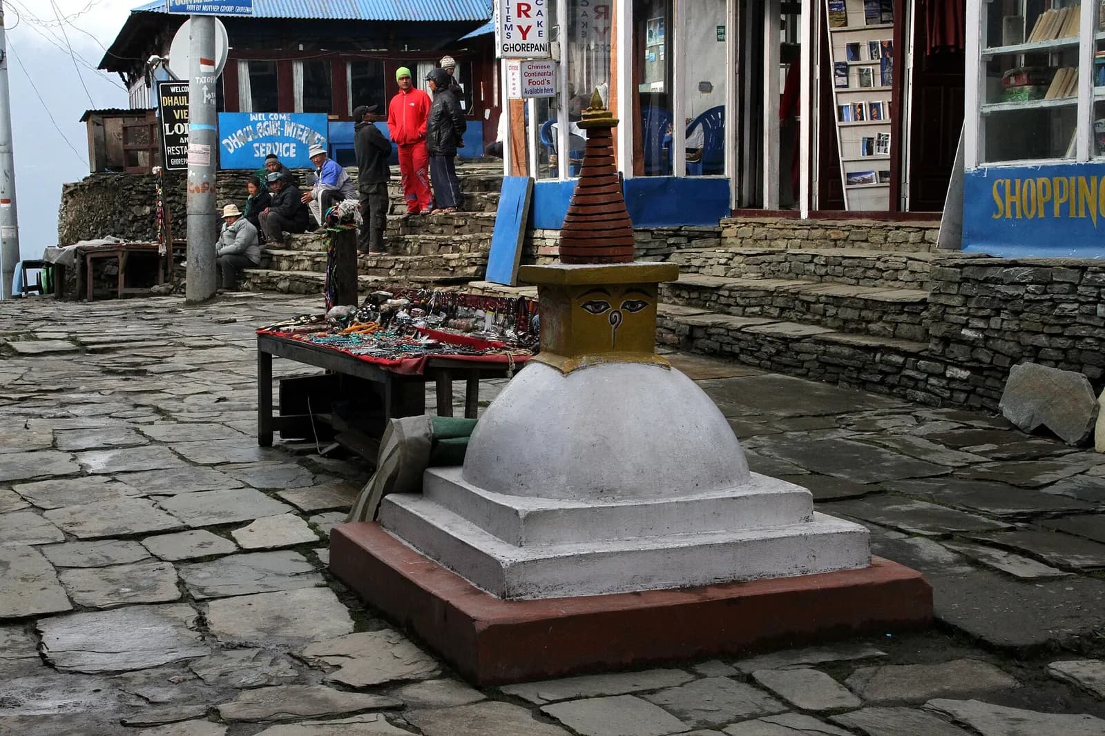 A small stupa on the stone-paved main street of Ghorepani