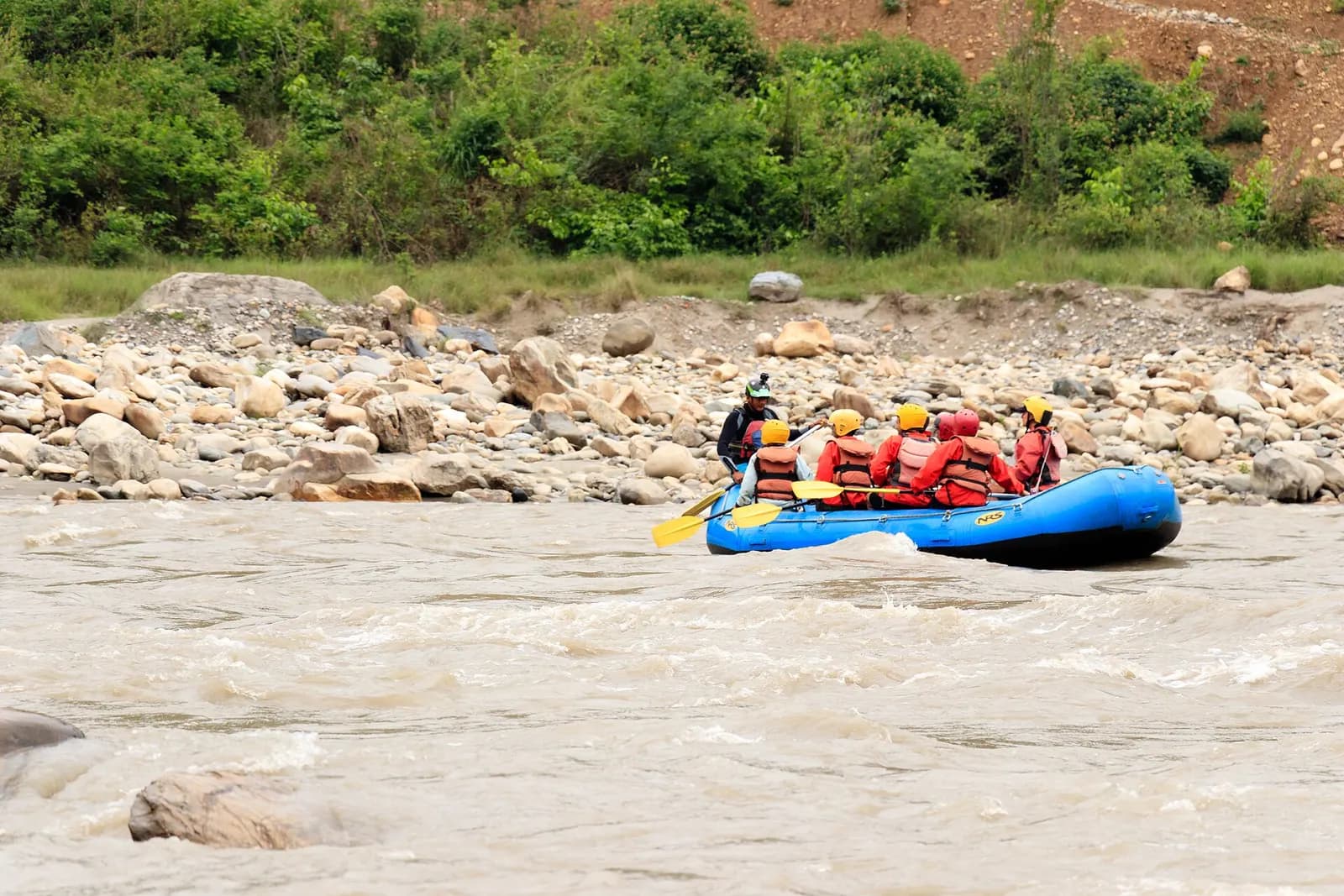 A raft running a rapid on the Trishuli River